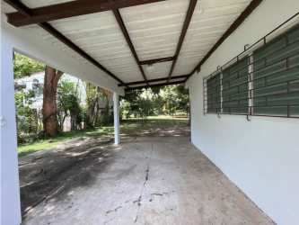 Lush front yard with shade trees beach house for sale Coronado Panama
