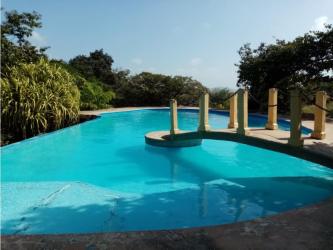 Swimming pool surrounded by tropical garden at Linda Vista Paradise Sajalices Panama