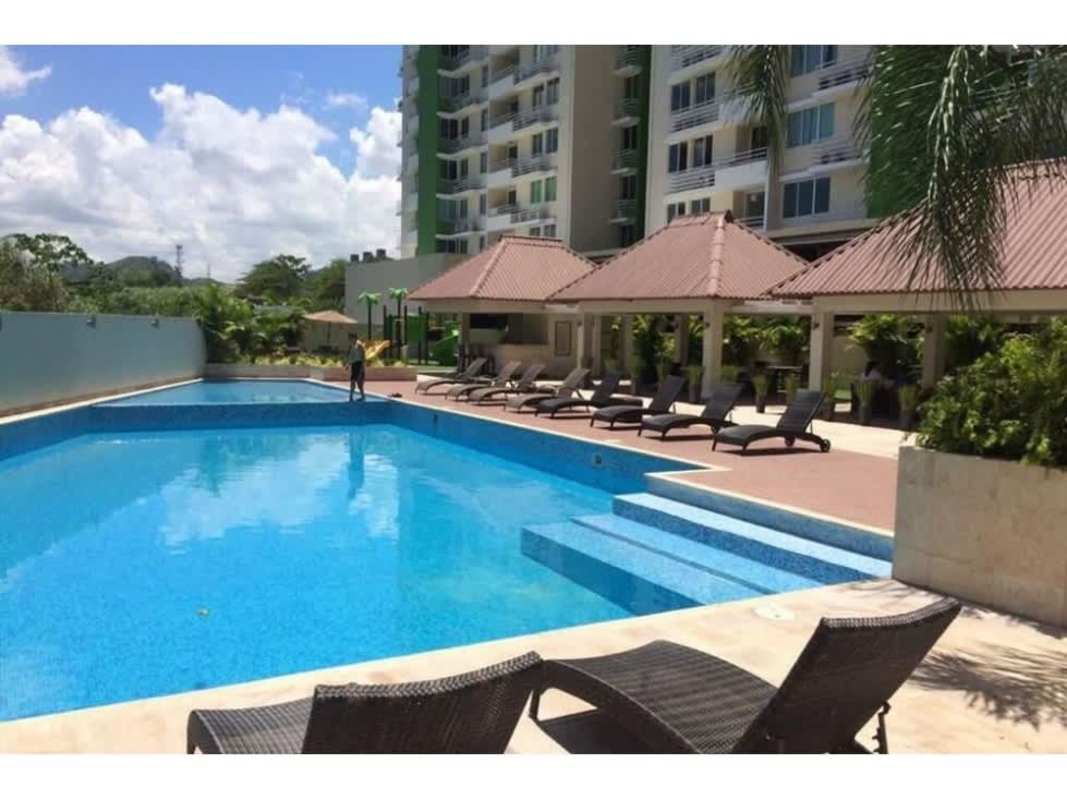 Outdoor swimming pool with lounge chairs at PH Green Park Panama City