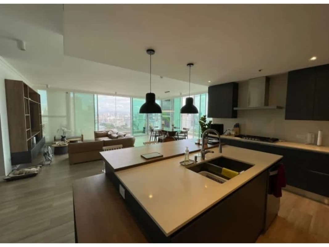 Sleek Italian style kitchen open to dining and living, panoramic windows PH Altamira Residences Bella Vista Panama