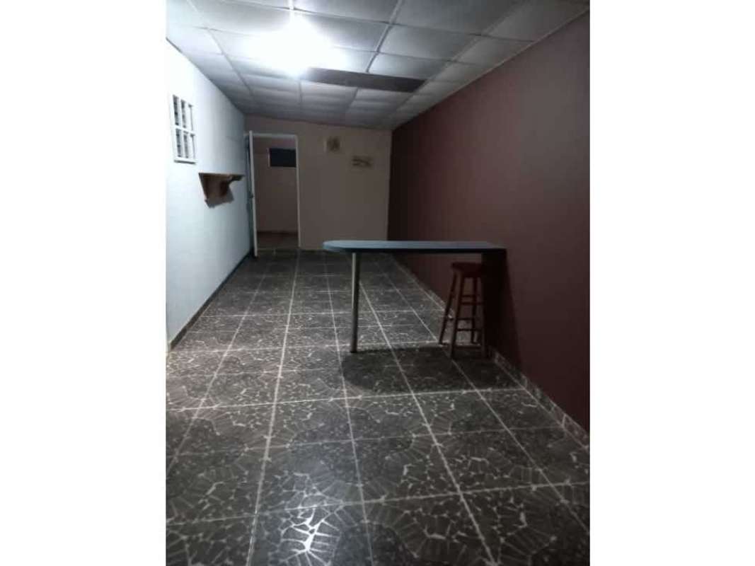 Living room with tile flooring, bright windows in Las Cumbres house Panama