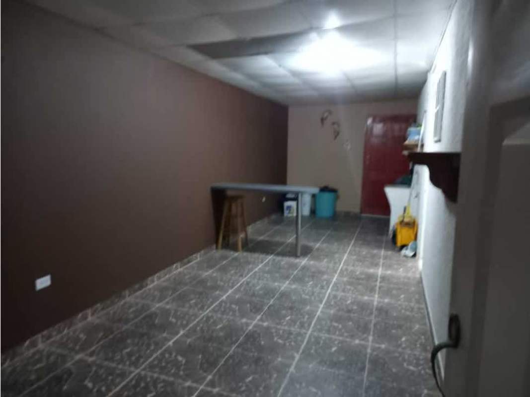 Traditional kitchen with cabinetry and tile backsplash in house for sale Chilibre, Panama