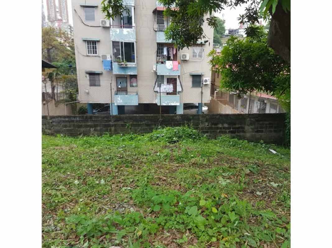 View of nearby apartment complex with balconies and green lawn in Panama City