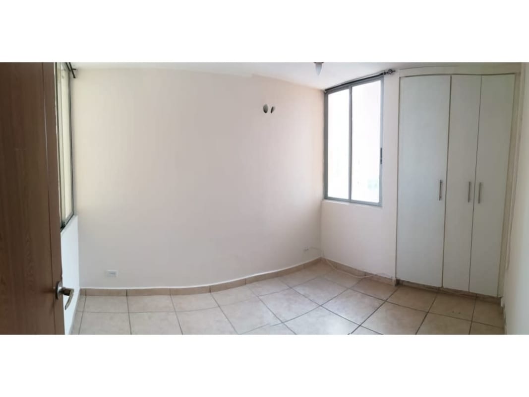 Bedroom featuring built-in wardrobe, tiled floors, air conditioning and large city view window in PH Victoria Hills Panama