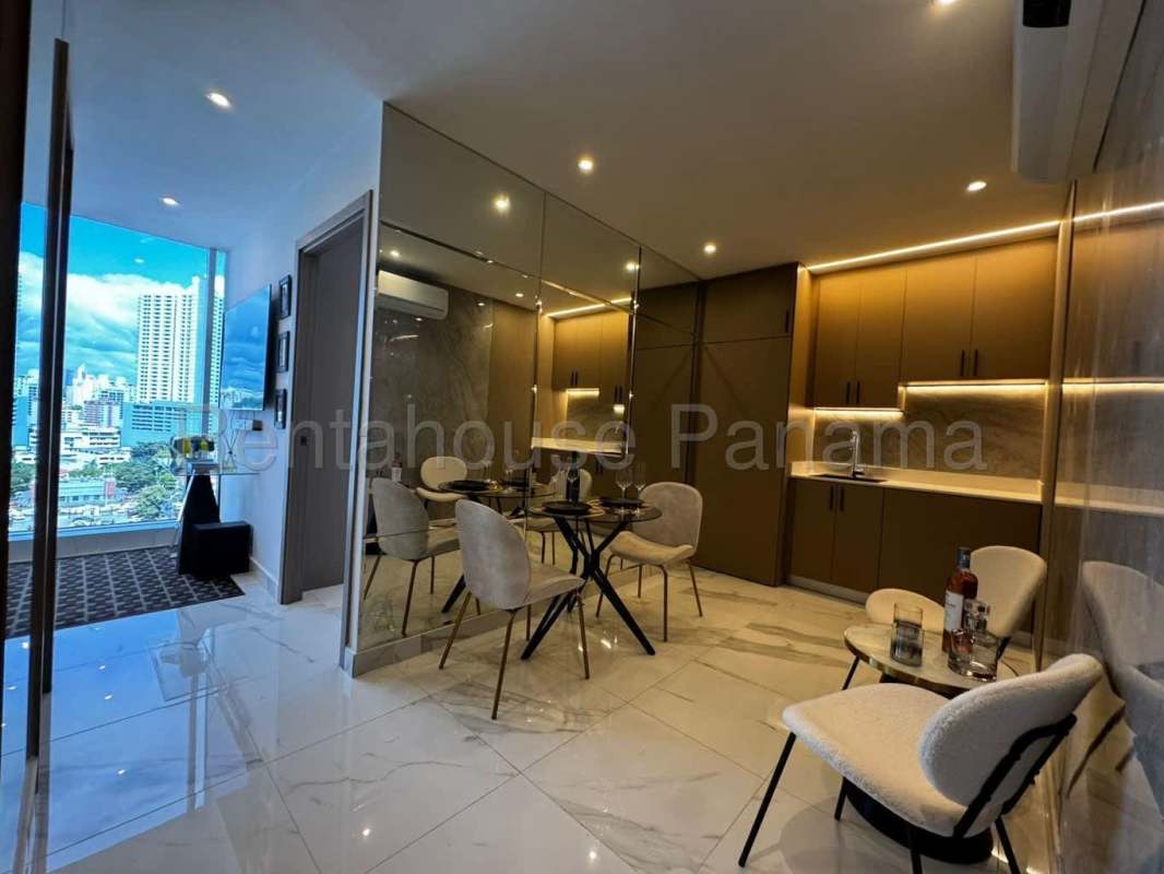 Modern studio bathroom with marble tile shower and glass enclosure at The Walker Panama