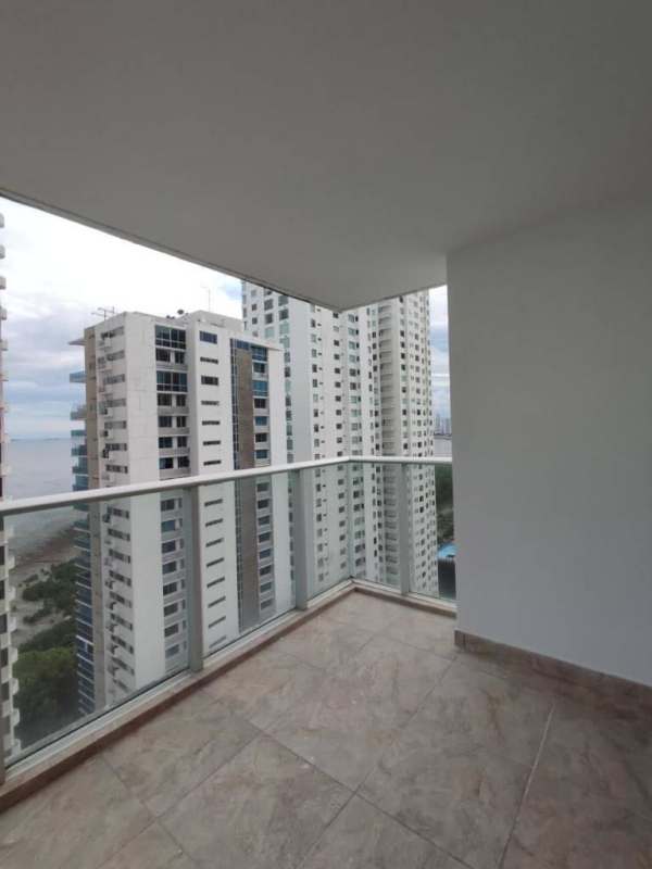 Spacious living room with floor-to-ceiling windows and balcony access at PH Lumiere Costa del Este Panama City