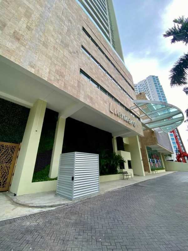 Corner balcony with glass railings overlooking Pacific Ocean and Costa del Este skyline PH Lumiere Panama