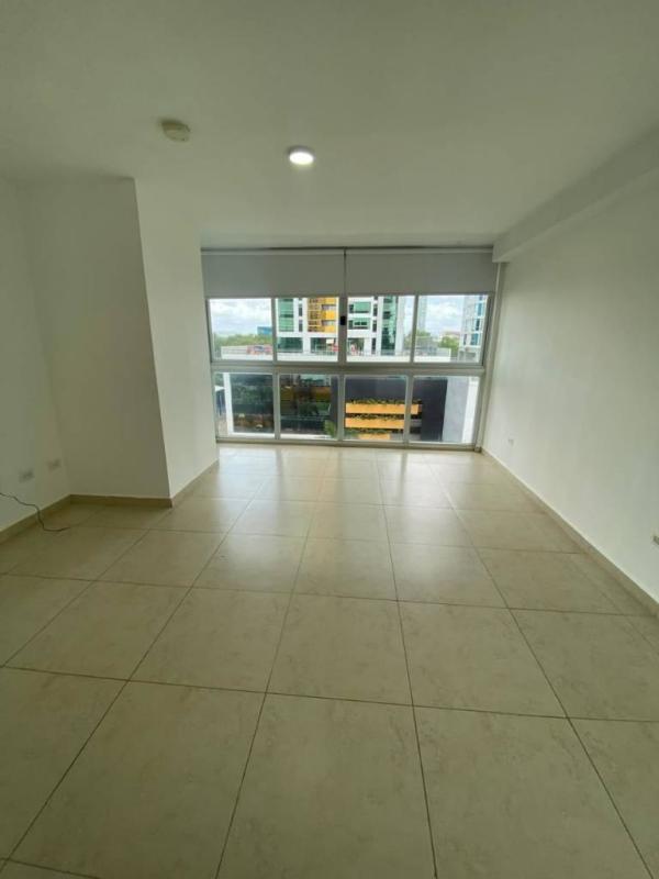 Bedroom with large windows, ensuite bathroom, and tile floors in PH Lumiere Costa del Este Panama City