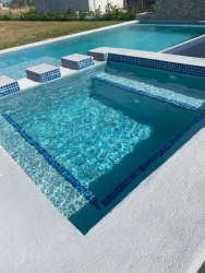 Jacuzzi next to private swimming pool in Palmeras del Golf beach house Coronado Panama