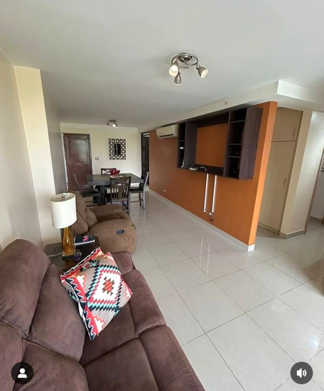 Bedroom with split AC, wall shelves, tile floor, and furniture in PH Rokas Condado del Rey Panama