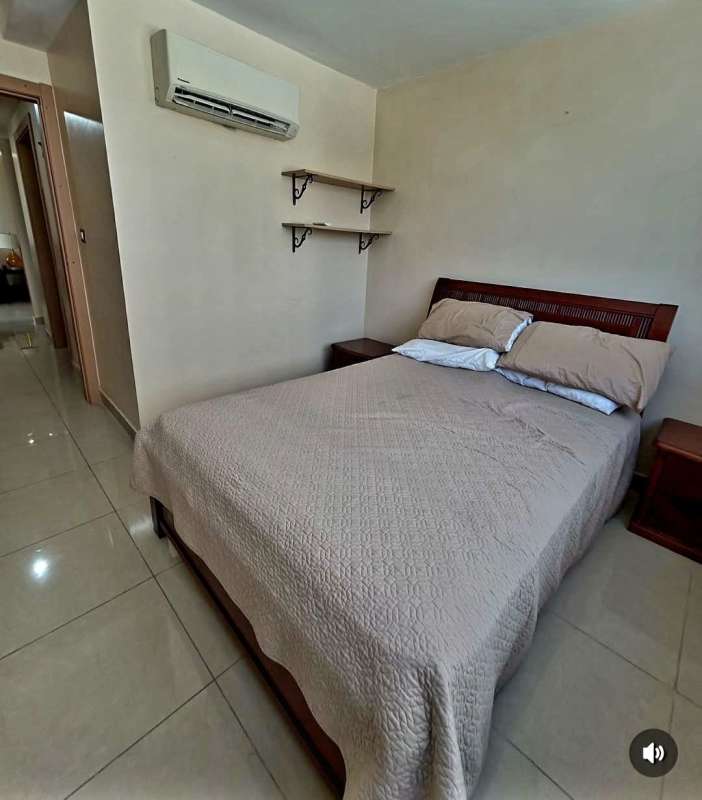 Empty bedroom with built-in wardrobe, red curtains, tile floors, window in PH Rokas Condado del Rey