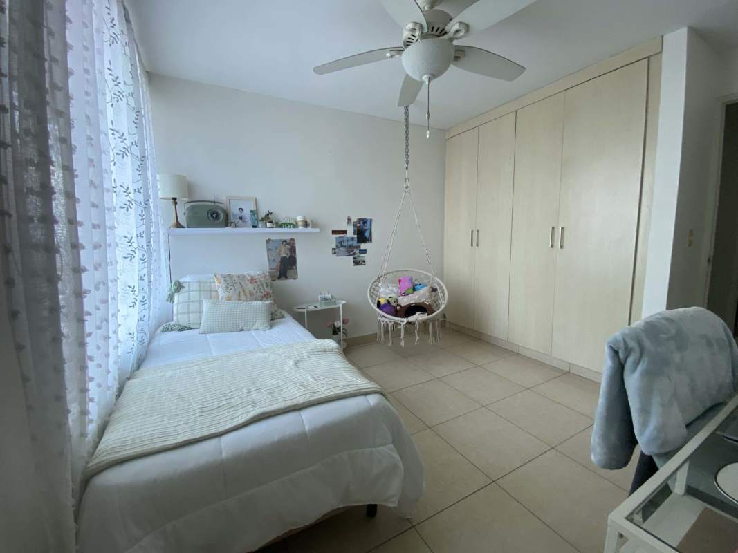 Secondary bedroom with large window city view closet in PH Costa View Costa del Este Panama