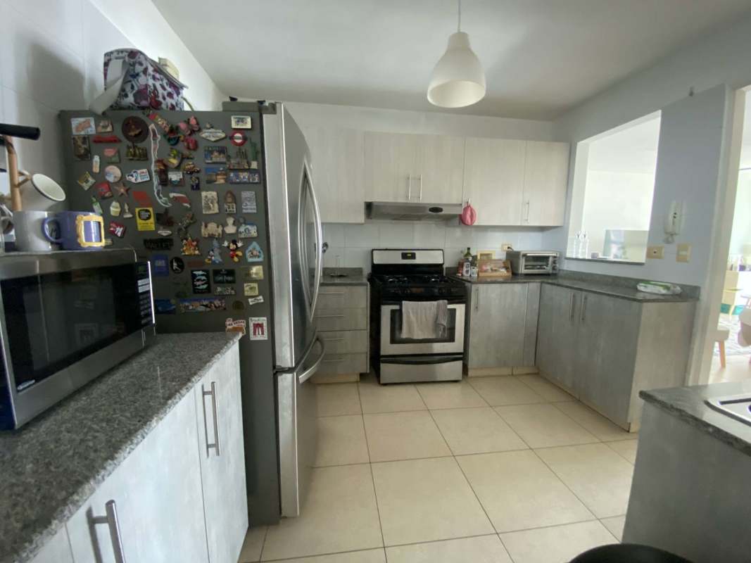 Kitchen with granite countertop, appliances in PH Costa View Costa del Este Panama