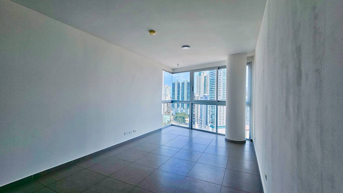 Living-dining room with panoramic windows and skyline view in PH Signature Point Panama