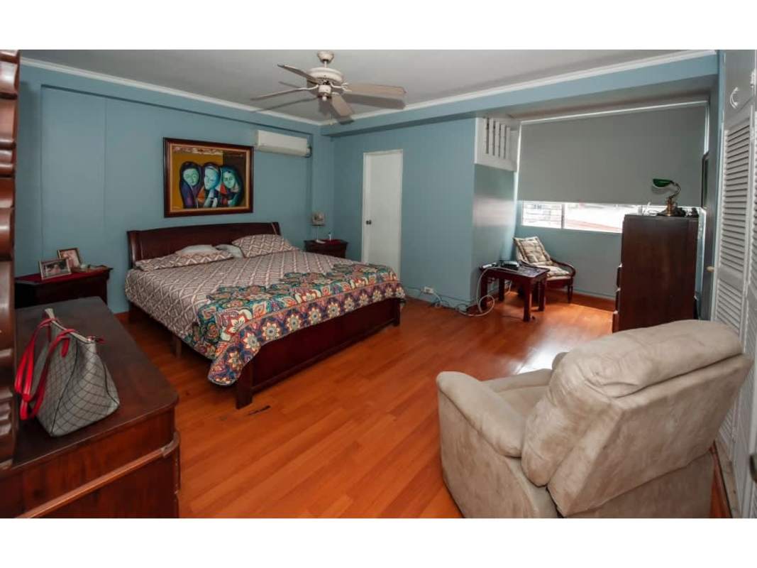 Master bedroom with wood flooring, closet and ceiling fan in PH Continental Tower El Cangrejo Panama City