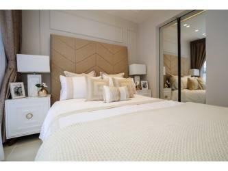 Aerial of building tower with balconies, outdoor pool, and skyline surroundings at PH Portofino El Dorado Panama