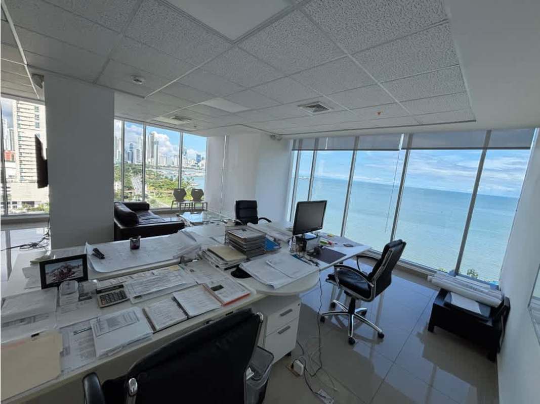 Casual office lounge space with ocean skyline backdrop in Balboa Office Center Panama