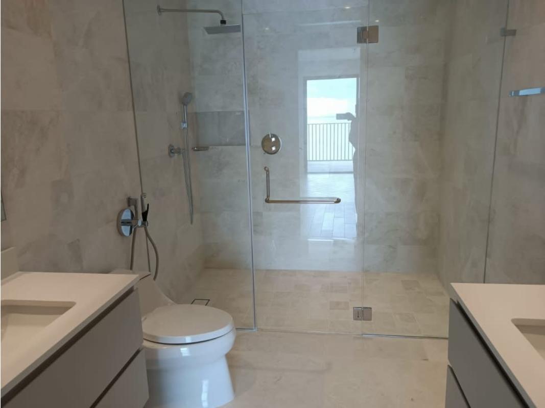 Master bedroom with floor-to-ceiling windows and Pacific Ocean views at PH Seascape Panama