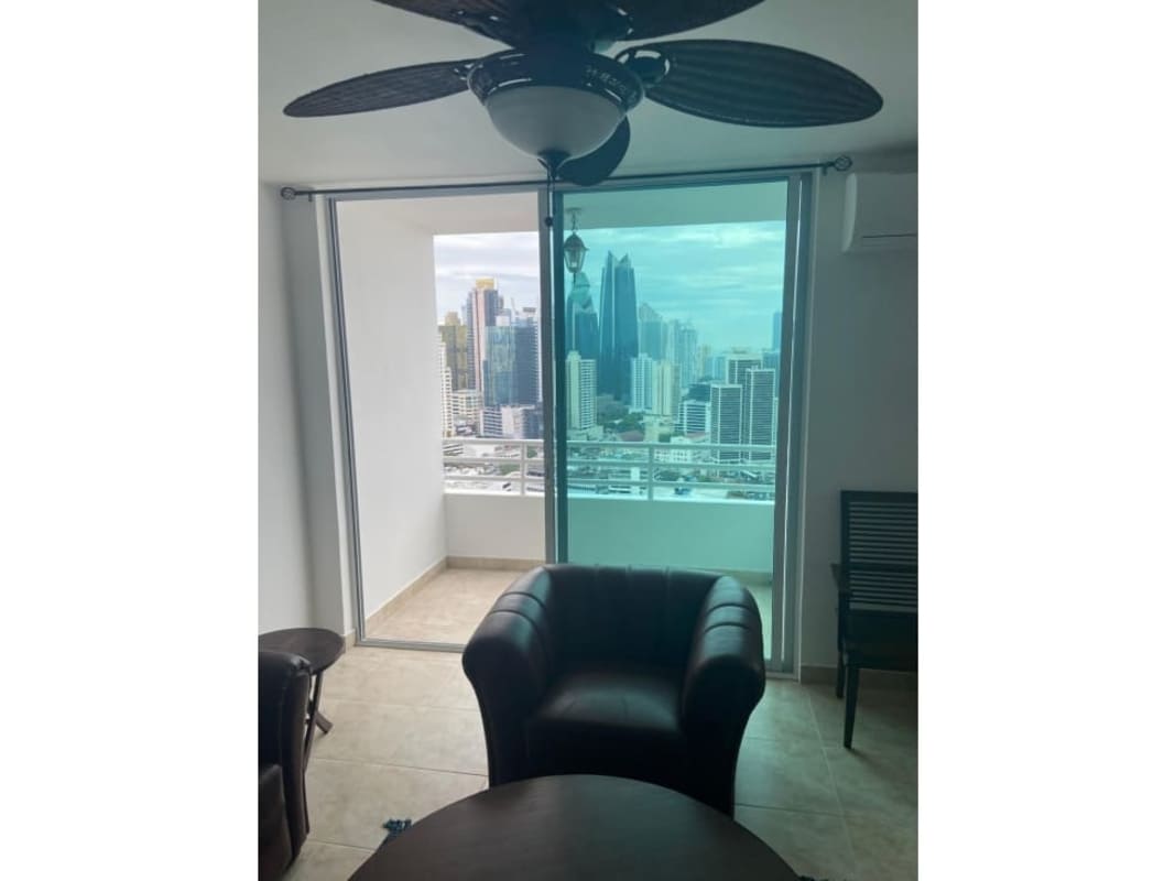 Bedroom with large window, inverter AC, ceiling fan overlooking city skyline PH Marquis Tower Panama