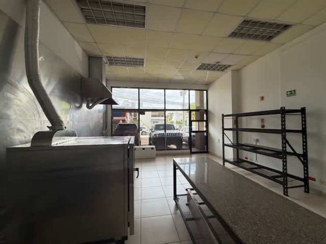 Mezzanine office or storage area overlooking retail space in Marbella Plaza