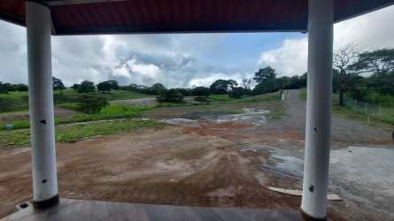 Large open plot with cleared earth green surroundings Las Lajas Panama
