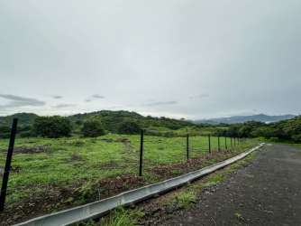 Lush green fields and hills at Montevita residential land community Panama