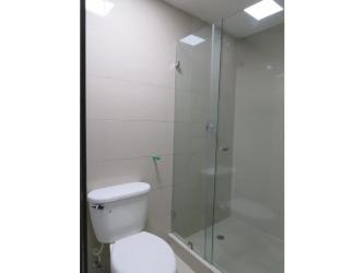 Modern bathroom featuring glass shower, white tile in PH Urbis Tower rental Panama City