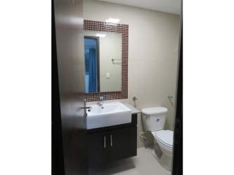 Modern kitchen with cabinets, fridge, gas stove, tile backsplash in PH Urbis Tower Panama