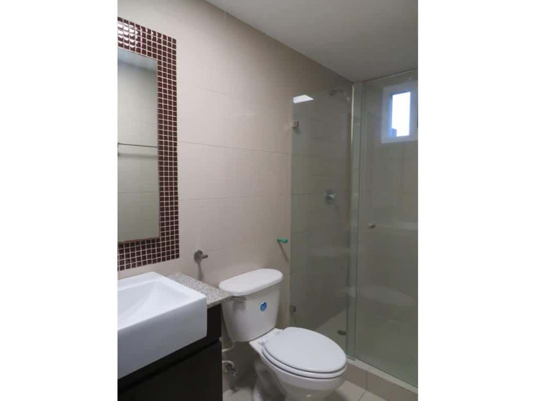 Bathroom with glass shower enclosure, granite sink counter, modern design Urbis Tower Panama