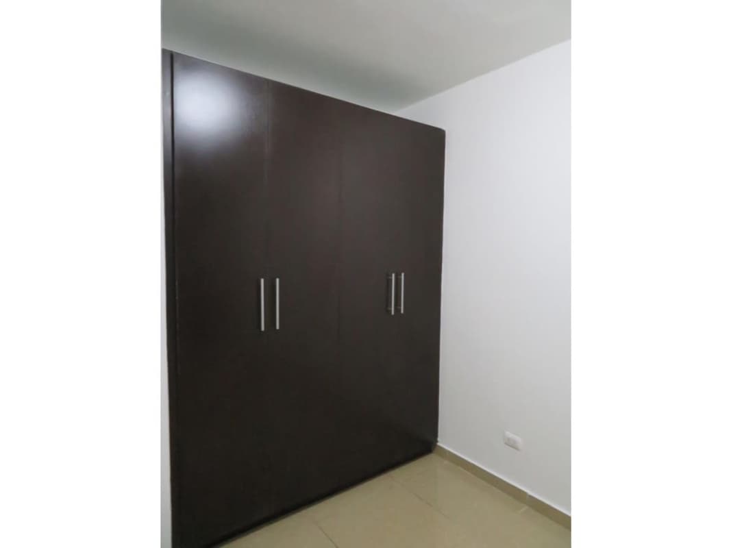 Bedroom with built-in wardrobe, tile floors, natural light Urbis Tower Panama