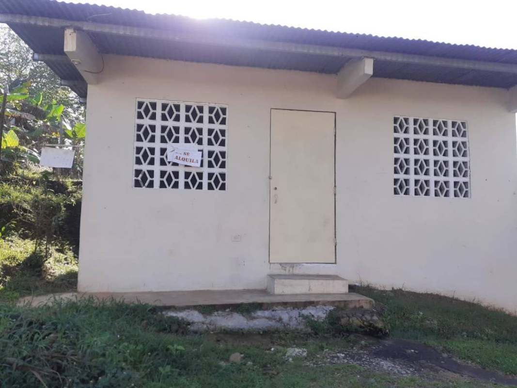 Single story affordable rental with block windows, front porch, metal roof in Chepo Panama