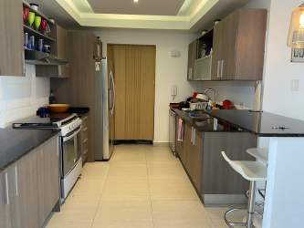 Massive lagoon saltwater swimming pool with white sand beach inside Playa Blanca Resort Panama