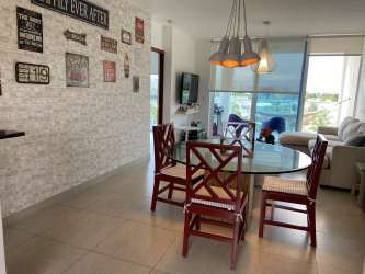 Bright bedroom with queen bed, TV, AC, wardrobe and pool views Playa Blanca Beach Resort Panama