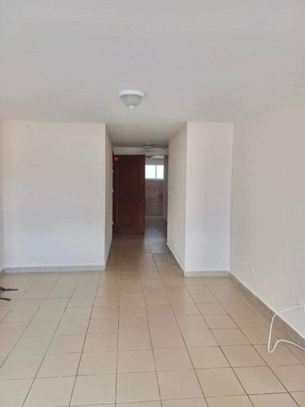 Modern mid-rise apartment building with balconies and trees in PH Terrazas de San Francisco Panama City