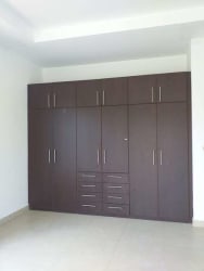 Bedroom featuring large built-in wardrobe in Hacienda Pacifica residence San Carlos Panama
