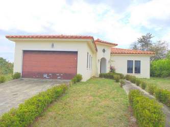 Mediterranean single-story home facade with garage at Hacienda Pacifica San Carlos