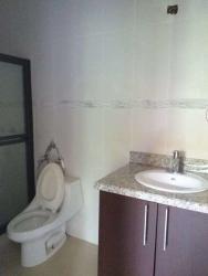 Spacious covered patio terrace with ceiling fan facing pool at Hacienda Pacifica San Carlos