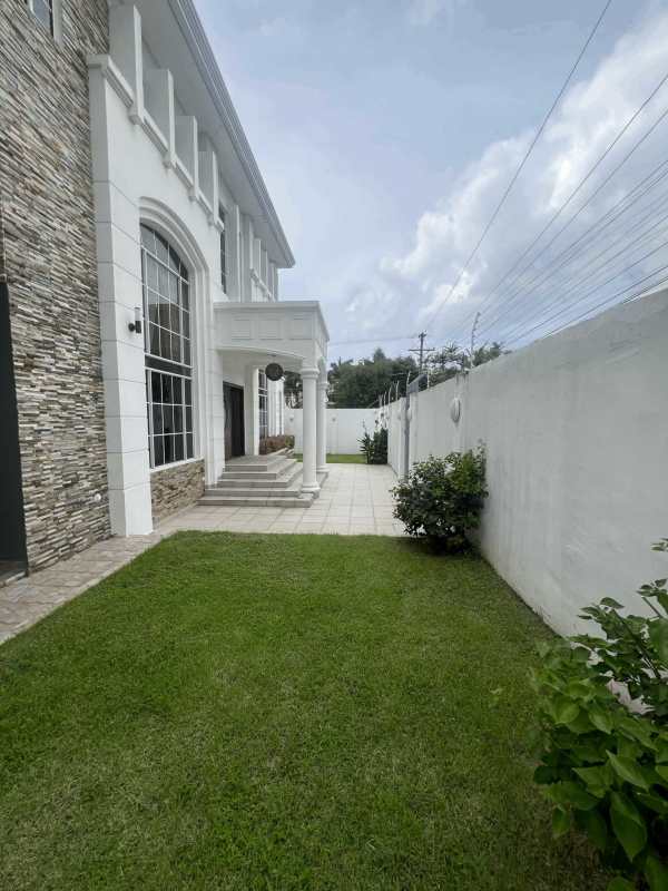 Master bedroom with large window, marble tile floors and ensuite bathroom Panama