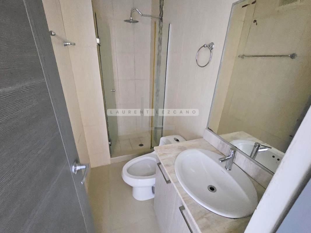 Minimalist bathroom with glass enclosed shower and contemporary sink in PH Green Park Tower 700 Condado del Rey Panama