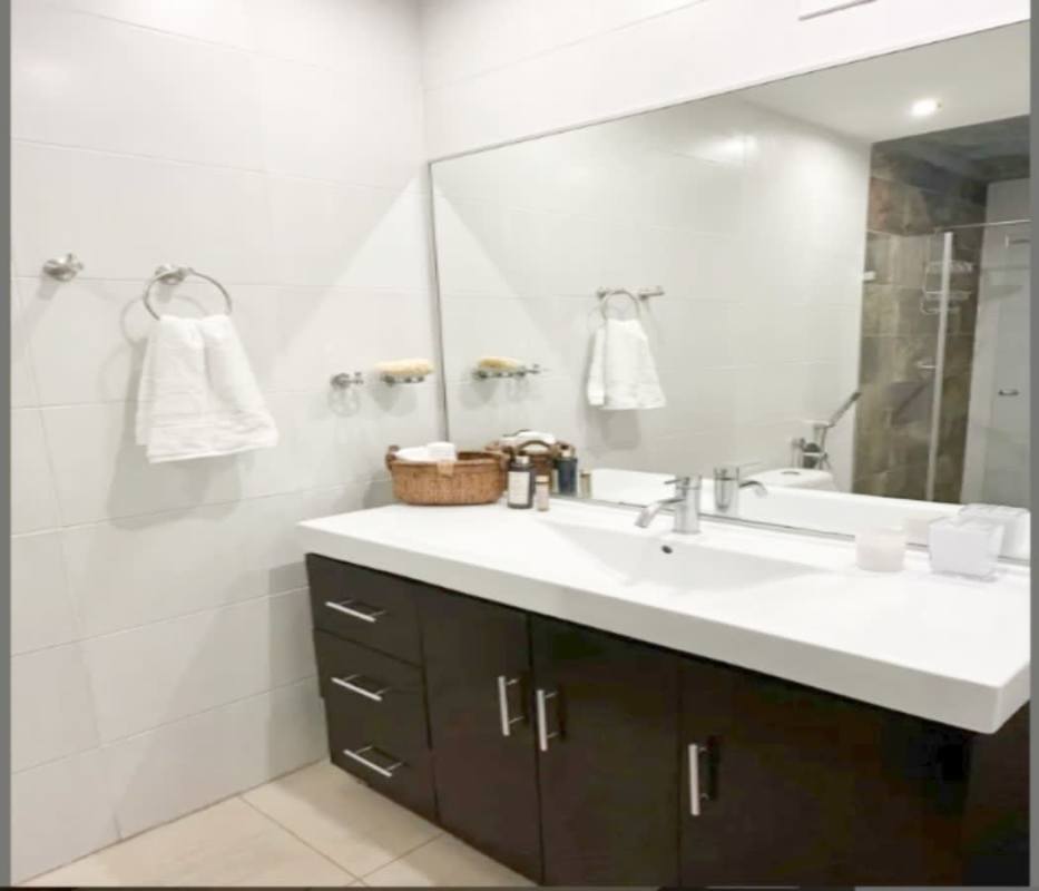 Pool area with jacuzzi, lush landscaping PH Belle View Tower Panama