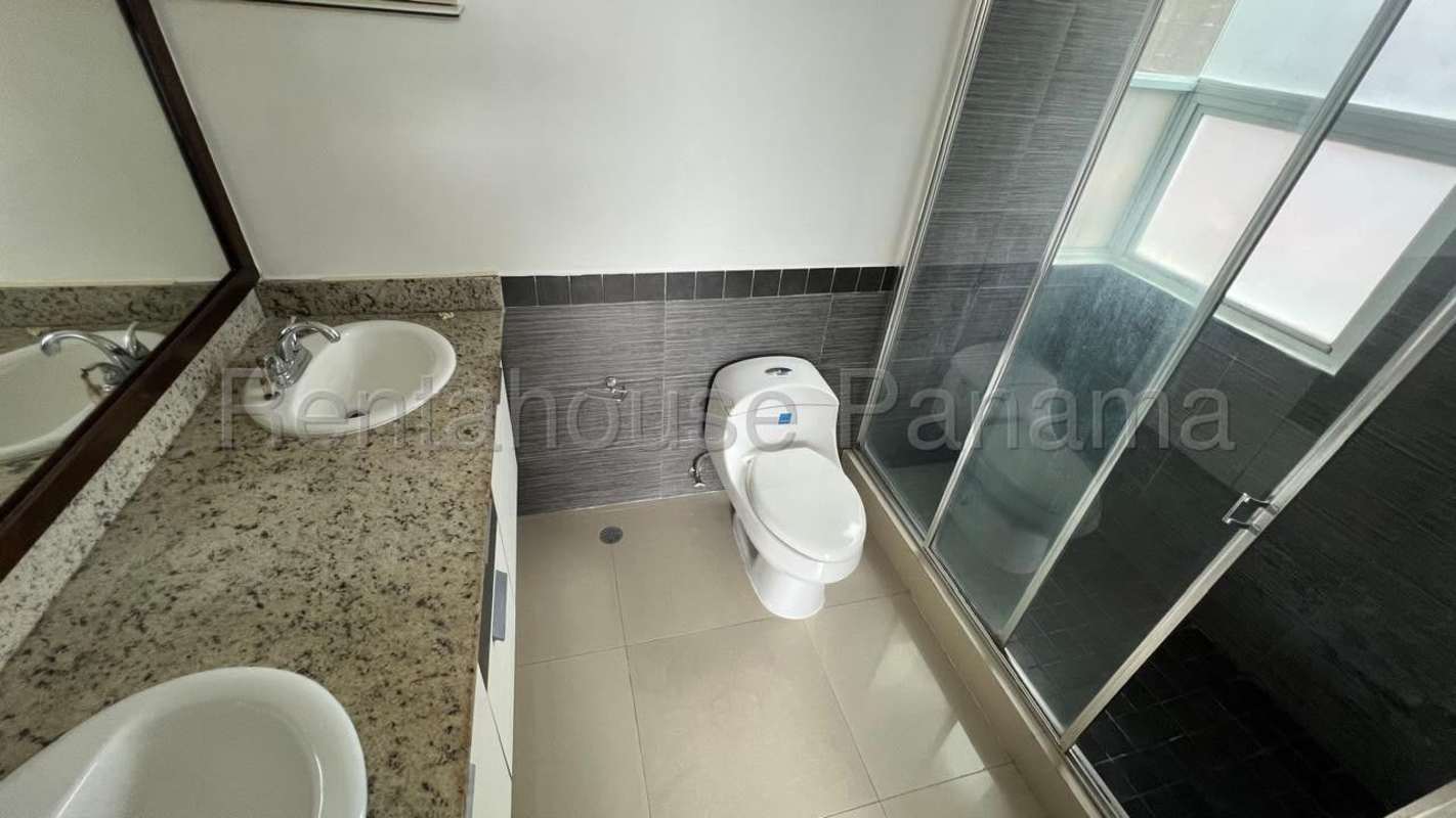 Bedroom with built-in closet and AC, porcelain tile floor, garden view in PH Pine Hills Panama