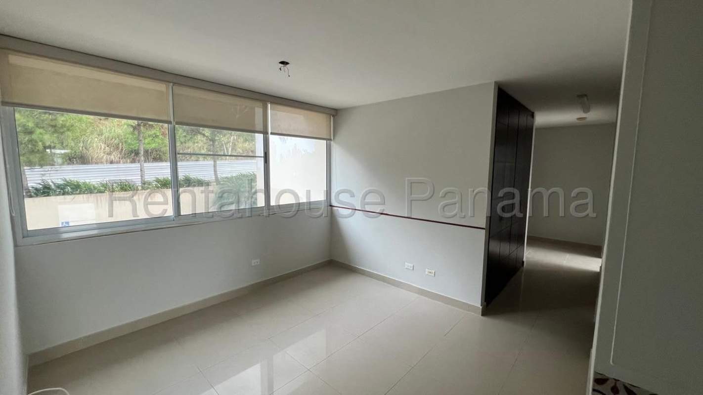 Children's play area surrounded by gardens in PH Pine Hills Albrook Panama