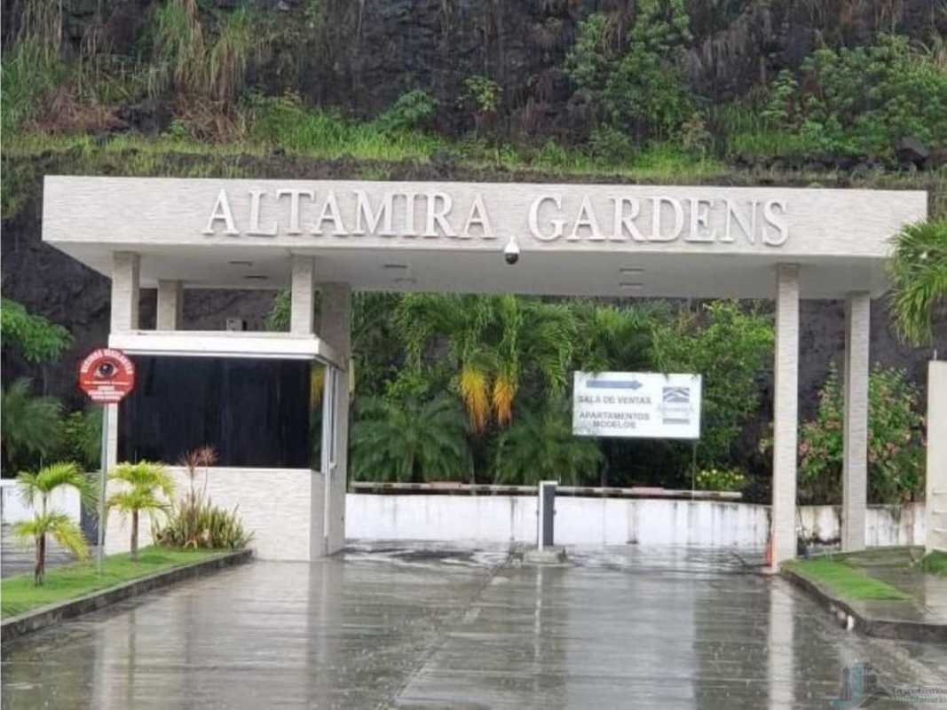 Gated entrance with security booth and landscaped greenery at Altamira Gardens Ancon Panama City