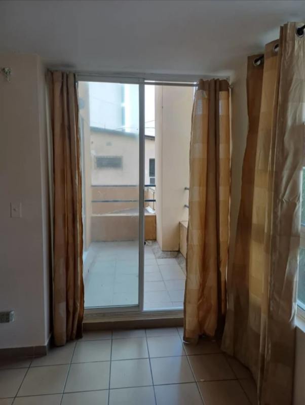 Living or bedroom with sliding glass door leading to balcony San Francisco Plaza Panama