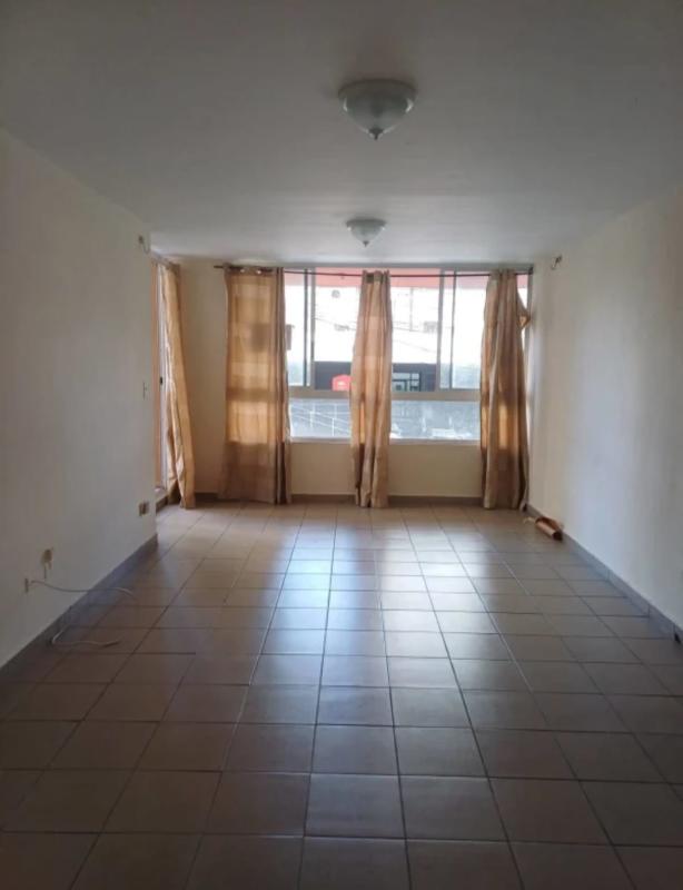 Apartment living room with large window and neutral tiled flooring PH San Francisco Plaza Panama