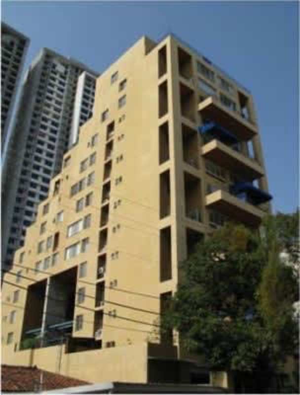 Modern beige multi-story apartment building with balconies in PH San Francisco Plaza Panama City
