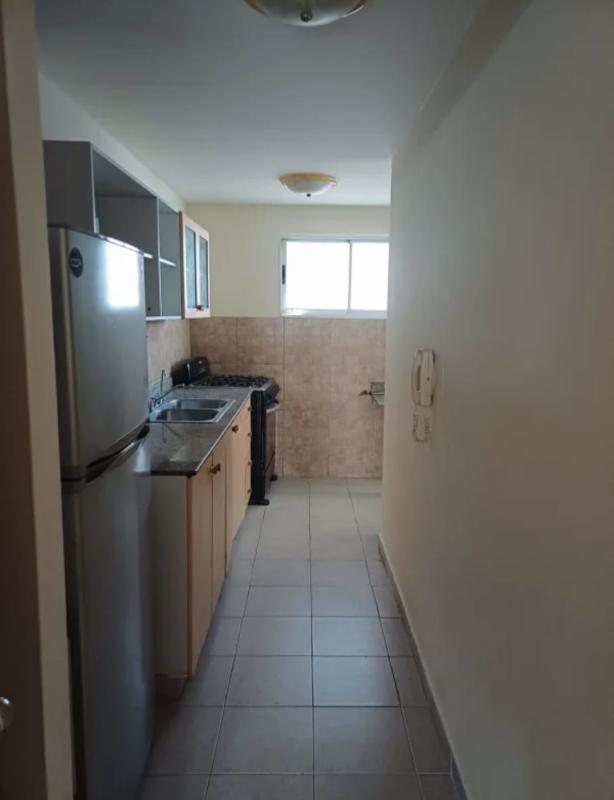 Compact galley kitchen with fridge stove granite countertop for rent in San Francisco Plaza Panama