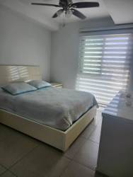 Second bedroom with built-in closet park views at Mosaic Panama Pacifico