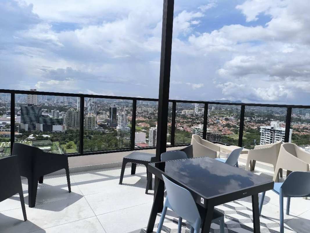 Stylish rooftop sky bar and lounge overlooking skyline at PH Arcadia Costa del Este