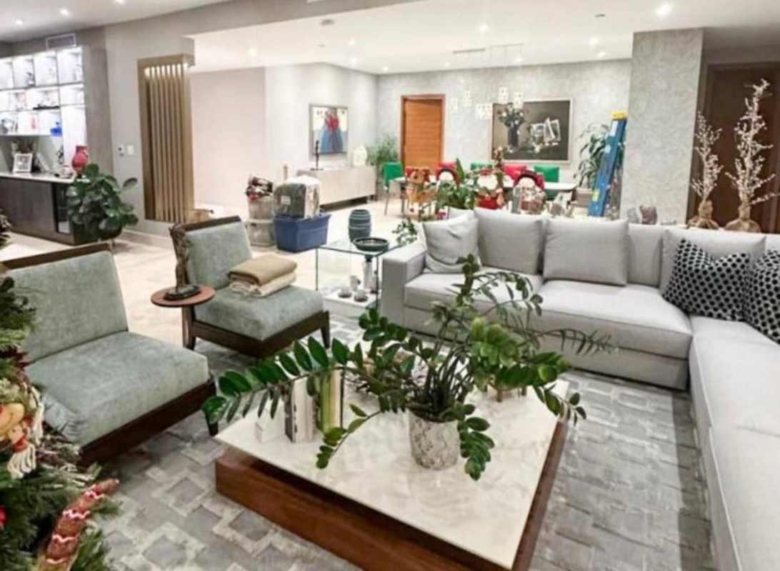 Contemporary kitchen with large island, white cabinetry and high-end appliances in The Crescent Santa María Panama